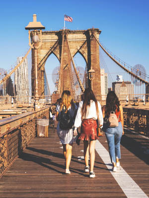 Girls walking on the Brooklyn Bridge